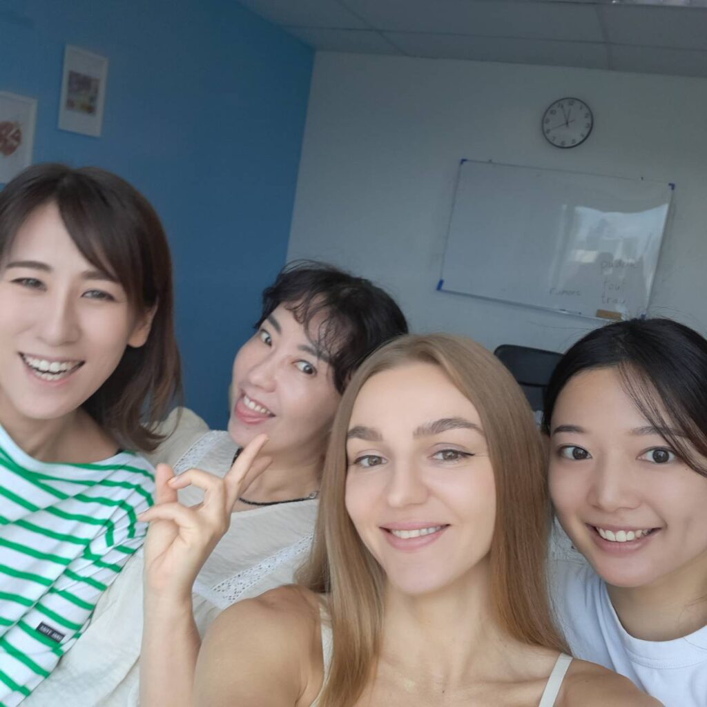 International students smiling together in classroom at GEOS Thailand Bangkok