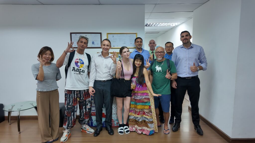 International English students and teachers celebrate course completion in Bangkok ED visa program